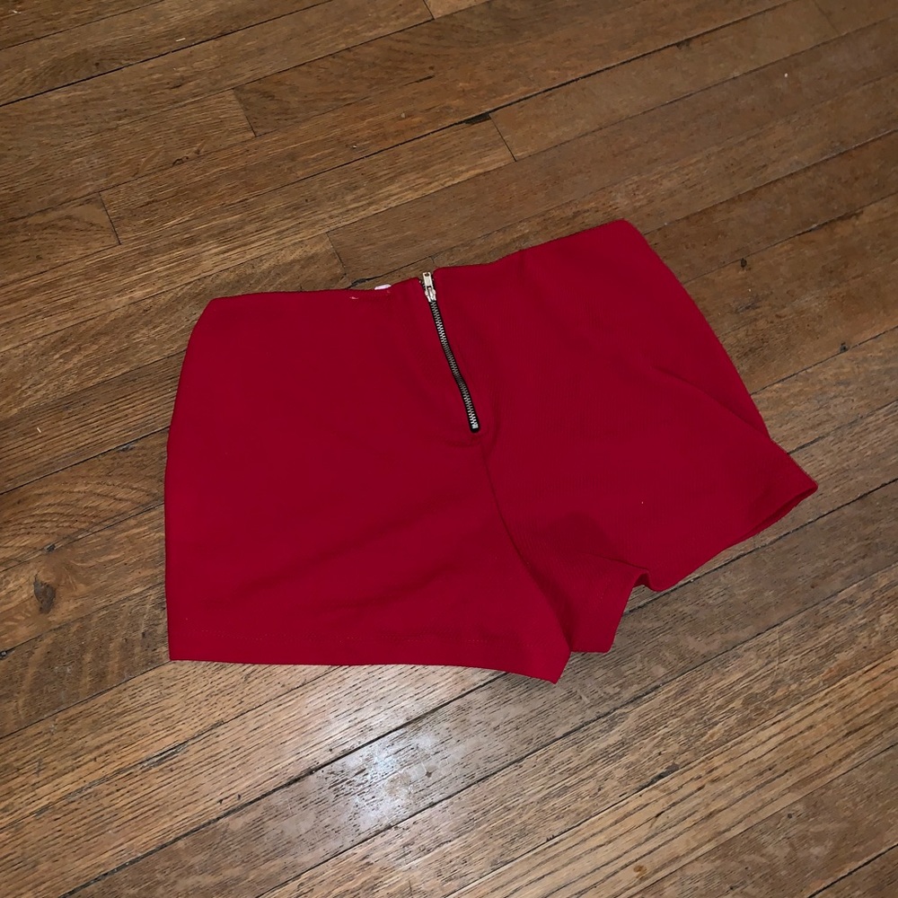 Red zippered “hot shorts” size s